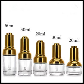 China Clear Glass Dropper Bottles Easy Carrying With Gold / Silver Press Lid Cap supplier